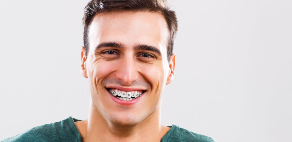 man getting braces as an adult